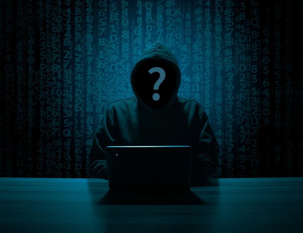 Pirate informatique face à un écran, illustration de la fuite de données des 48 millions de propriétaires